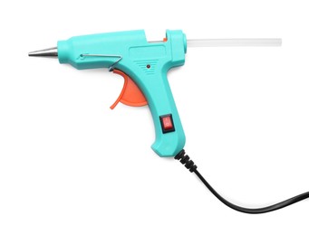 Turquoise glue gun with stick isolated on white, top view