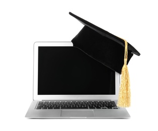 Graduation hat with gold tassel and laptop isolated on white. Space for text