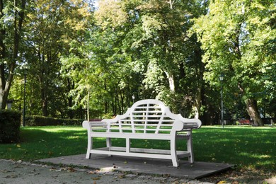 Beautiful white bench in public city park