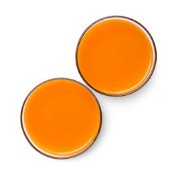 Two glasses of fresh carrot juice on white background, top view