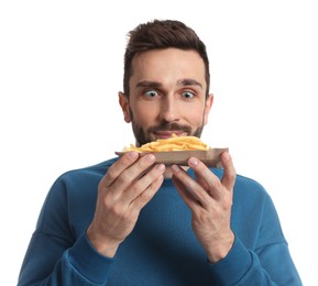 Hungry man with French fries on white background