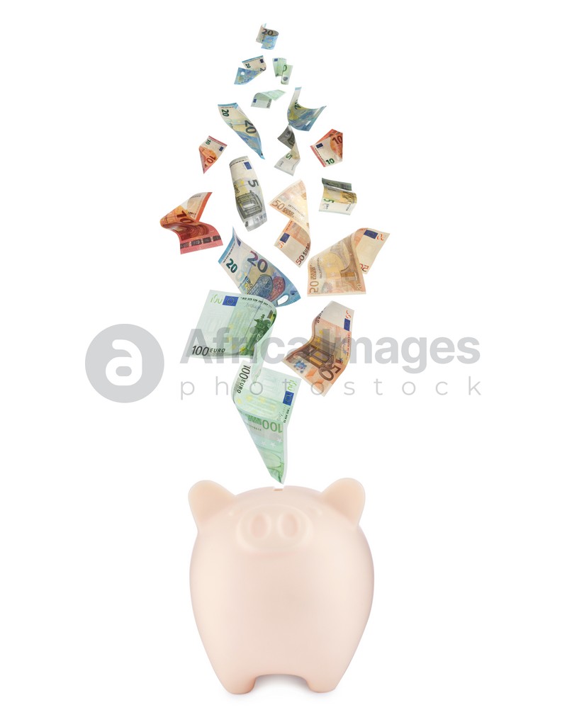 Euro banknotes falling into beige piggy bank on white background