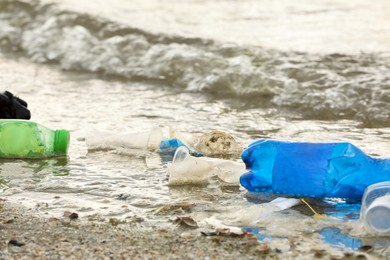 Beach polluted with plastic garbage. Ecological problem