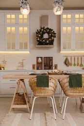 Spacious kitchen decorated for Christmas. Interior design