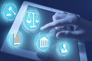 Laws, legal information and online consultation. Woman using tablet, closeup. Icons over device