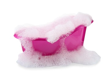 Pink toy bathtub with foam isolated on white