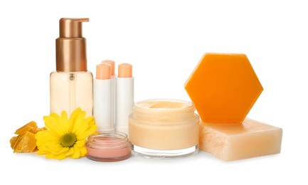 Natural beeswax and different cosmetic products on white background