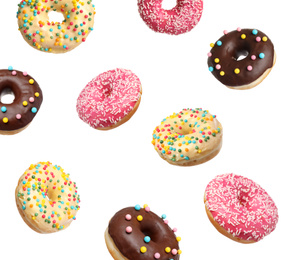 Image of Set of falling delicious donuts on white background