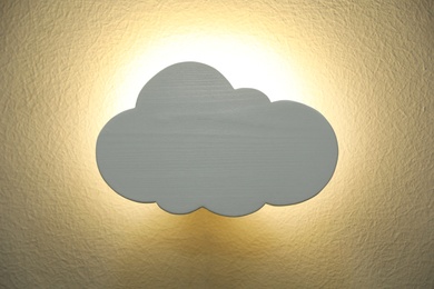 Cloud shaped glowing night lamp on wall