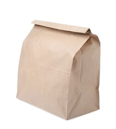 Closed kraft paper bag isolated on white