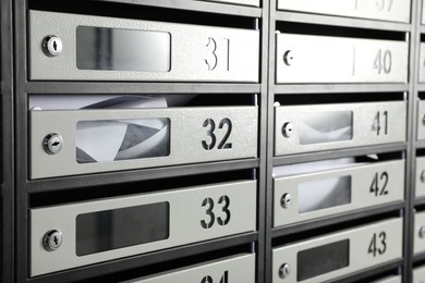 New mailboxes with keyholes, numbers and receipts as background