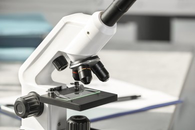 Photo of Modern medical microscope in laboratory, closeup. Space for text