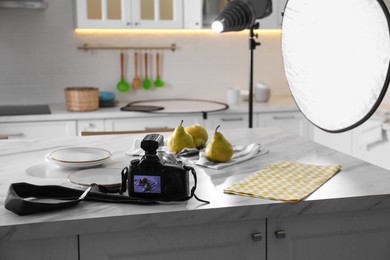 Professional equipment and many pears on table in kitchen. Food photo