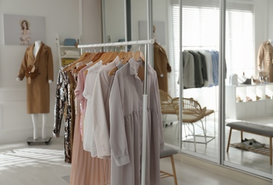 Collection of stylish women's clothes in modern boutique