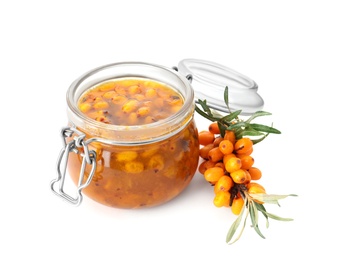 Delicious sea buckthorn jam in jar and fresh berries on white background