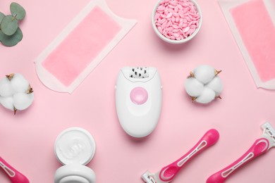 Photo of Flat lay composition with different epilation products on pink background
