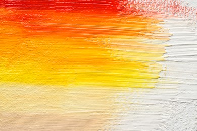Beautiful strokes of colorful oil paints as background, closeup