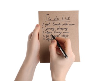 Woman checking to do list on white background, closeup