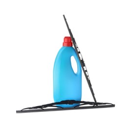 Bottle of windshield washer fluid and wipers on white background
