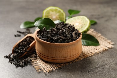 Dry bergamot tea leaves on grey table