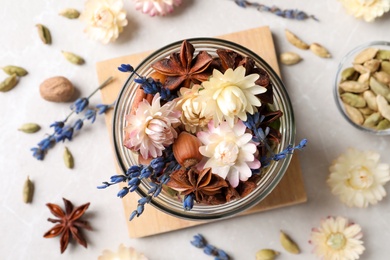 Aroma potpourri with different spices on white table, flat lay