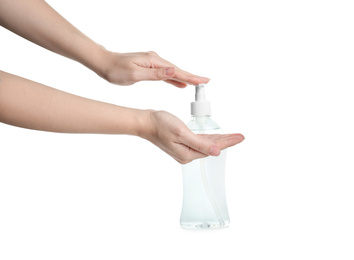 Photo of Woman applying antiseptic gel on hand against white background, closeup