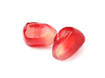 Juicy red pomegranate seeds on white background