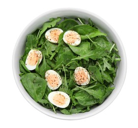 Photo of Delicious salad with boiled eggs and herbs in bowl isolated on white, top view