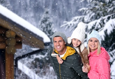 Happy family spending time together at winter resort