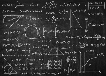 Many different math formulas written on blackboard. Algebra and Geometry