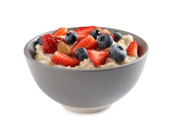 Tasty oatmeal porridge with blueberries, strawberries and almond nuts in bowl on white background