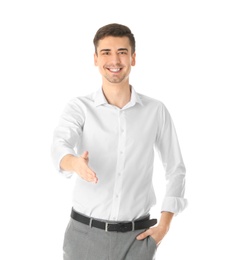 Business trainer reaching out for handshake on white background