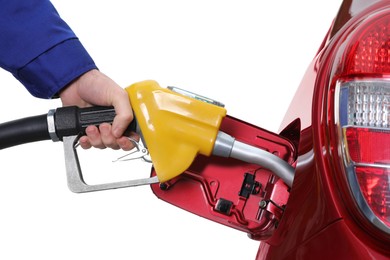 Worker filling up car with fuel on white background, closeup. Gas station