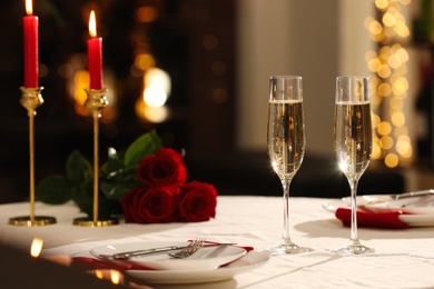 Romantic dinner table setting with glasses of champagne in restaurant