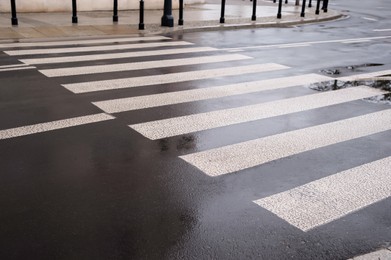 Pedestrian crossing in city outdoors after rain
