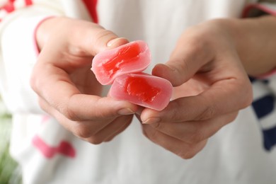 Photo of Woman with delicious mochi, closeup. Japanese cuisine