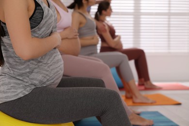 Group of pregnant women in gym, closeup. Preparation for child birth