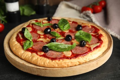 Delicious homemade pita pizza on black table
