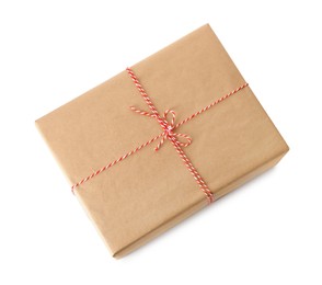 Gift box wrapped in kraft paper with bow isolated on white