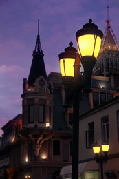Beautiful cityscape with glowing streetlights in evening