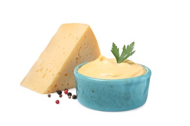 Tasty cheese, sauce with parsley and peppercorns on white background