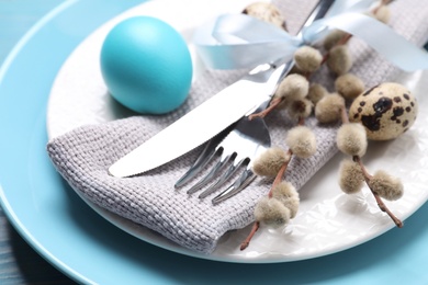Festive Easter table setting with eggs, closeup