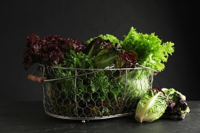 Different sorts of lettuce on black slate table