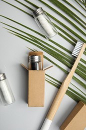 Flat lay composition with natural dental floss on light grey background