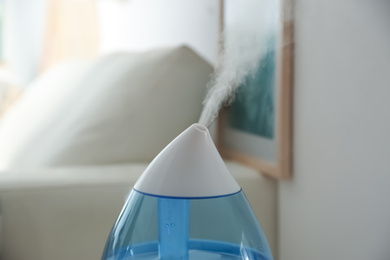Modern humidifier indoors, closeup view. Home appliance