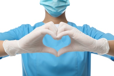 Doctor in medical gloves showing heart gesture on white background, closeup