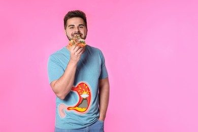Image of Improper nutrition can lead to heartburn or other gastrointestinal problems. Man eating pizza on pink background. Illustration of stomach with erupting volcano as acid indigestion