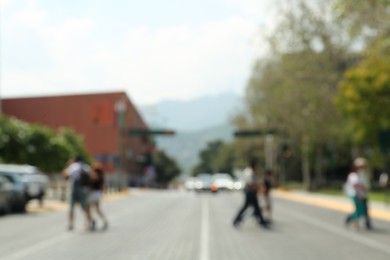 Photo of Blurred view of people crossing city street