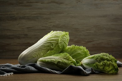 Fresh ripe Chinese cabbages on wooden table