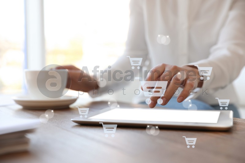 Delivery concept. Woman using modern tablet for online shopping indoors, closeup. Market cart illustrations